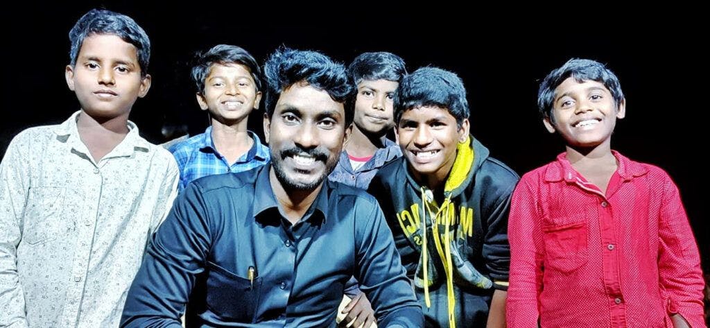 Hudson Raja with his kids. Children beneficiaries of Caring Hands Society of India